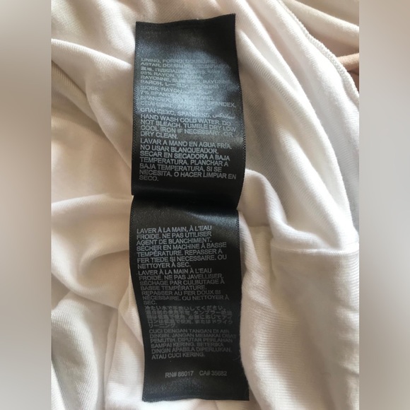 Bebe three colored long sleeve high low dress in sz M. Great condition. - Picture 15 of 15